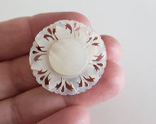 Load image into Gallery viewer, Estate Mother of Pearl MOP carved small sunflower brooch, Gray Barn Eclectic Finds online vintage store, hand holding brooch on fingertips. 
