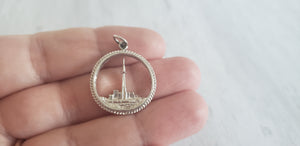 Vintage sterling silver 925 charm for charm bracelet of Toronto Ontario Canada skyline with CN Tower and Lake Ontario, sold by Gray Barn Eclectic Find vintage online store, charm held in hand to show detail
