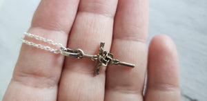 Vintage sterling silver 925 rose cross pendant and chain, Gray Barn Eclectic Finds online vintage store, held in hands to show scale and detail on front
