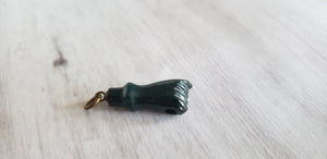 Victorian or Edwardian antique green bloodstone carved fist charm with crystal magnifier inset in clenched hand, Gray Barn Eclectic Finds online vintage store, close up of charm on white wooden background