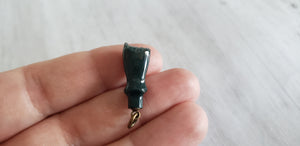  Victorian or Edwardian antique green bloodstone carved fist charm with crystal magnifier inset in clenched hand, Gray Barn Eclectic Finds online vintage store, held in hand to show scale