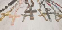 Load image into Gallery viewer, Group of vintage and handmade Catholic Christian rosaries in black, pink multi-colours, crystal, wood, Gray Barn Eclectic Finds online vintage store, rosaries lying flat on wooden surface