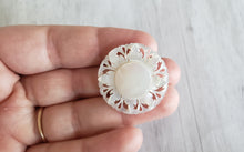 Load image into Gallery viewer, Estate Mother of Pearl MOP carved small sunflower brooch, Gray Barn Eclectic Finds online vintage store, held in hand