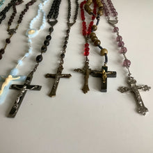 Load image into Gallery viewer, Vintage French rosaries, Gray Barn Eclectic Finds online vintage store, group of blue plastic, black bead, red crystal, round stone, and purple rosaries shot lengthwise