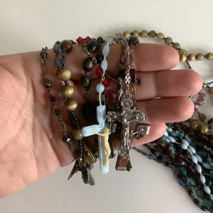 Vintage French rosaries, Gray Barn Eclectic Finds online vintage store, group of nine rosaries and chaplets held loosely in hand