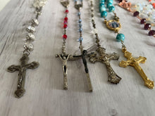 Load image into Gallery viewer, Group of vintage rosaries and chaplets on white wood background, Gray Barn Eclectic Finds online vintage store, photographed along their length