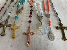 Load image into Gallery viewer, Group of vintage rosaries and chaplets on white wood background, Gray Barn Eclectic Finds online vintage store, group shot