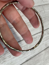 Load image into Gallery viewer, Set of three handmade round bangle bracelets in 925 sterling silver 2.75&quot; diameter (size large) with a hammered finish