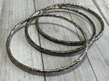 Load image into Gallery viewer, Set of three handmade round bangle bracelets in 925 sterling silver 2.75&quot; diameter (size large) with a hammered finish