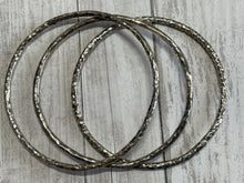 Load image into Gallery viewer, Set of three handmade round bangle bracelets in 925 sterling silver 2.75&quot; diameter (size large) with a hammered finish
