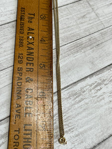 necklace chain shown beside a ruler to show length of 15"