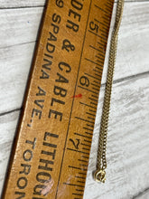 Load image into Gallery viewer, necklace chain shown beside a ruler to show length of 15&quot;
