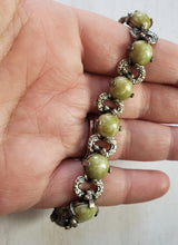 Load image into Gallery viewer, Estate Costume Scottish Miracle Glass and Silver Tone Bracelet - vintage costume jewelry, 1960s, scottish bracelet, mid century, avocado